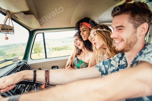 Preview: Happy friends driving a vintage minivan