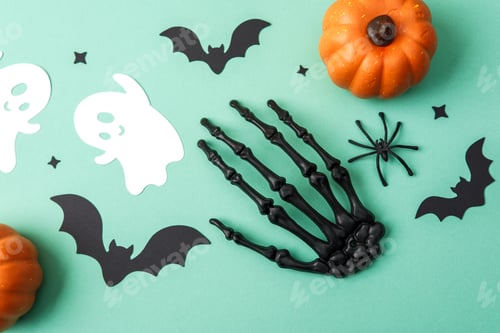 Preview: Halloween decorations with pumpkins bats ghosts spider skeleton hand on teal background.