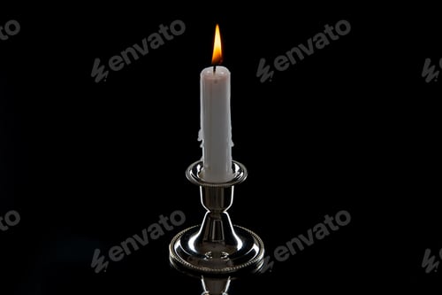 Preview: front view of burning candle in golden stand on dark surface death warrior palestine war