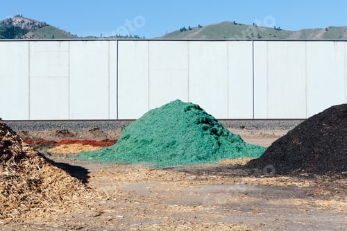 Preview: Piles of green bark wood chips used for landscaping, near Quincy