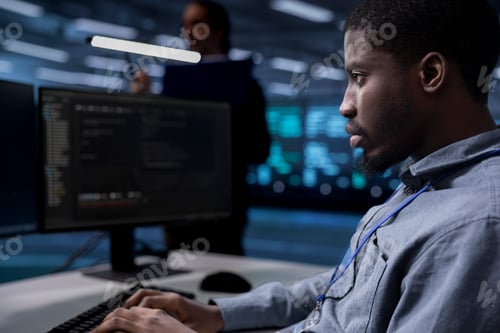 Preview: Computer scientist reconfiguring server room equipment, close up