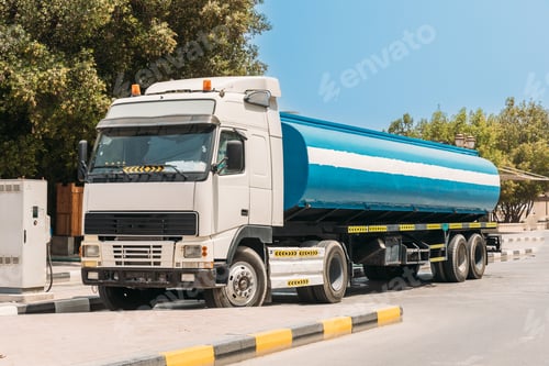 Preview: Water tank trailer unit, prime mover, refuel at gas and oil station in sunny summer day. Water tank