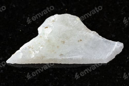 Preview: sample of rough white nephrite mineral on black