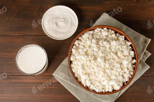 Preview: Cottage curd cheese in a wooden bowl on wooden table
