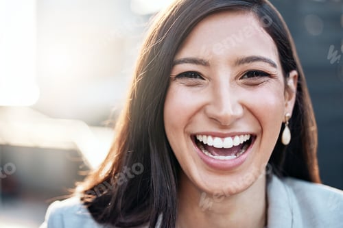 Preview: Shot of an attractive young businesswoman standing alone outside