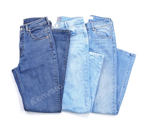 Preview: Stylish jeans on white background, top view
