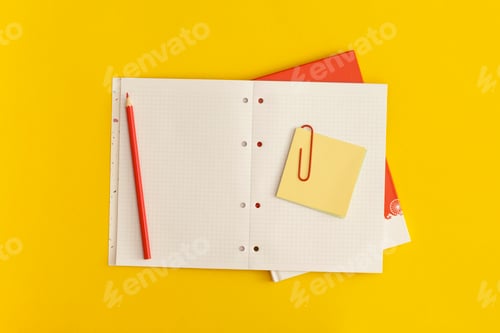 Preview: Notebook on yellow background. Top view. Flat lay. Back to school concept.