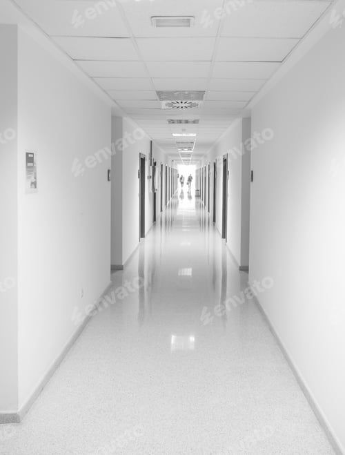 Preview: Vertical shot of a long corridor with a white interior
