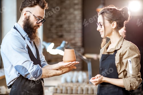 Preview: Man and woman working at the pottery shop