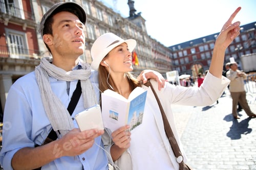Preview: Tourists Walking In La Plaza Mayor With Traveler Guide