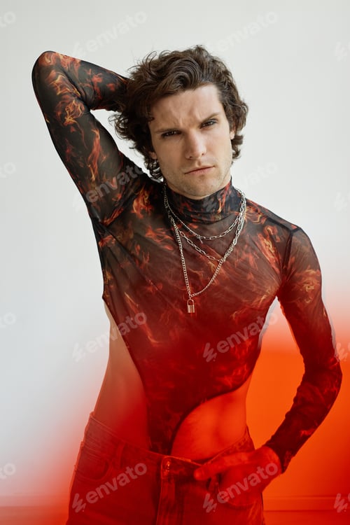 Preview: Non binary man posing sensually against white
