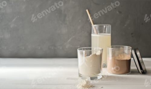 Preview: whey protein drink in a glass and jars with protein powder on beige background