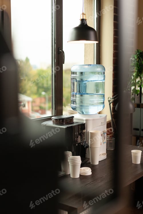 Preview: Close up of water dispenser on table in workplace at office
