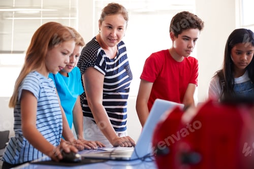 Preview: Group Of Students In After School Computer Coding Class Learning To Program Robot Vehicle
