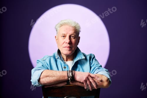 Preview: Senior man in blue denim jacket standing in front of camera against full moon