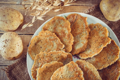 Preview: National Belarusian dish - potato pancakes "draniki" close-up on a linen background