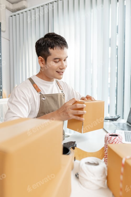 Preview: Ecommerce concept with startup entrepreneur handling goods, showing online store operations