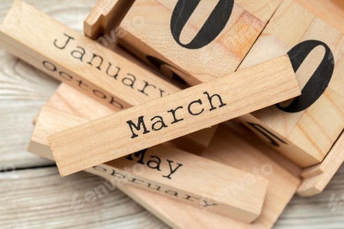 Preview: top view of parts of wooden calendar on dark wooden tabletop