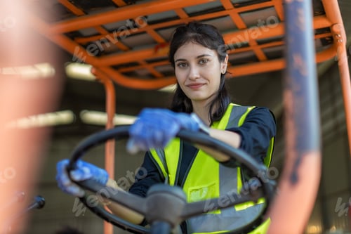 Preview: WoMan worker at forklift driver happy working in industry factory logistic ship.