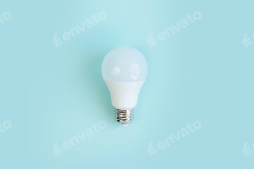 Preview: one LED light bulb on blue background. energy saving concept. minimalism