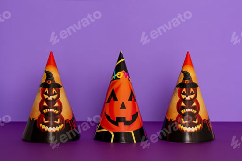 Preview: Halloween party hats on purple background.