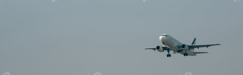 Preview: Departure of jet plane in cloudy sky, panoramic shot with copy space