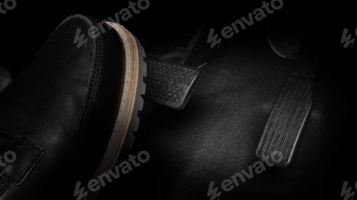 Preview: Accelerator and breaking pedal in a car. Close up