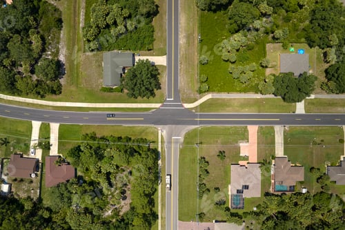Preview: Aerial view of american small town in Florida with private homes between green palm trees