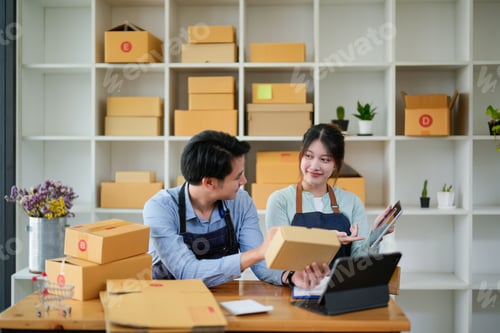 Preview: startup small business owner working with tablet at workplace. freelance man and woman seller check