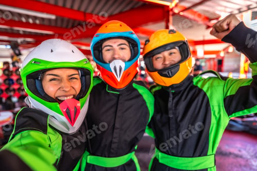 Preview: Friends enjoying karting activity posing for selfie