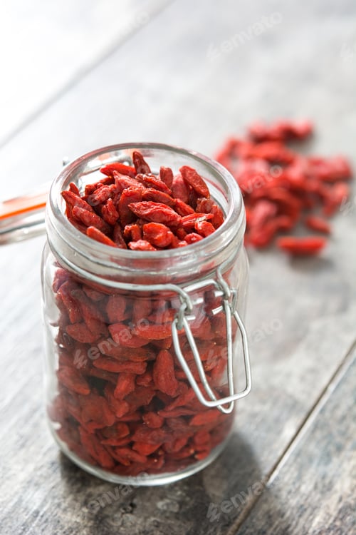 Preview: Jar of Dried Goji Berries on Wooden Table