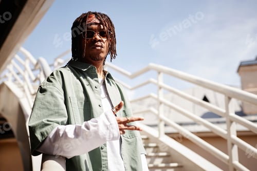 Preview: Serious African American guy in sunglasses and stylish casualwear