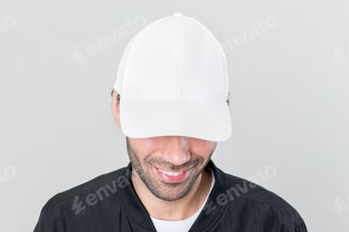 Preview: Happy man wearing a white cap