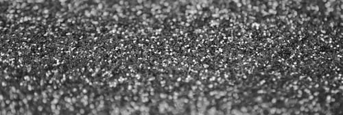 Preview: Silver decorative sequins. Background image with shiny bokeh lights from small elements