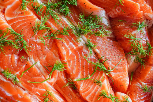 Preview: close-up of fresh salmon fillets seasoned with pepper and garnished with sprigs of dill
