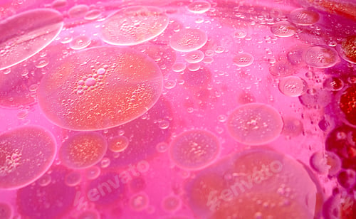Preview: abstract pink and purple background formed by oil drops on water