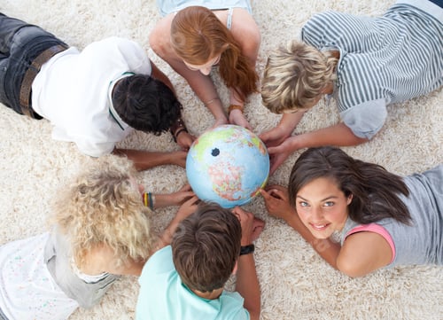 Preview: Group Of Friends Lying On The Floor Examining A Terrestrial World