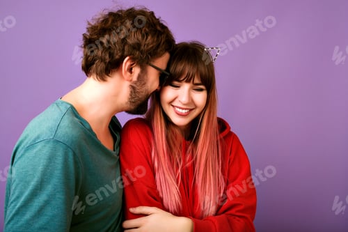 Preview: Bright positive studio lifestyle portrait of couple hipsters having fun,