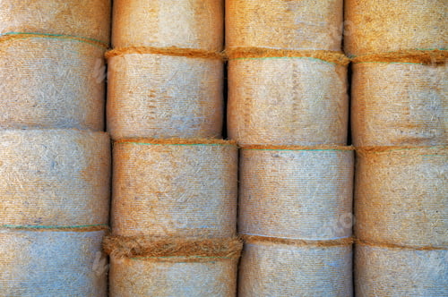 Preview: Bales of straw in a farm storage as a forage for cattle in winter