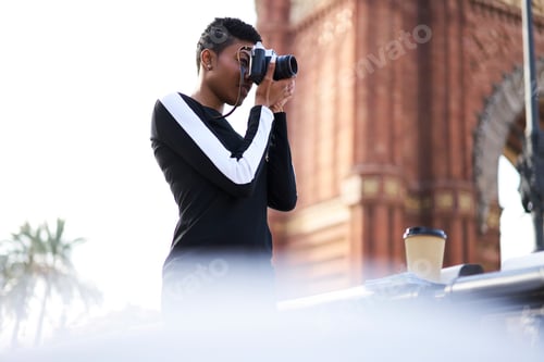 Preview: Young photographer taking photo on camera