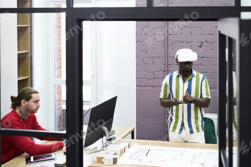 Preview: Graphic designers working together at office