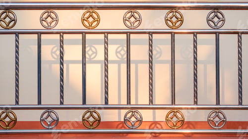 Preview: Vintage silver and golden stainless steel fence in front of beige cement and tile wall background