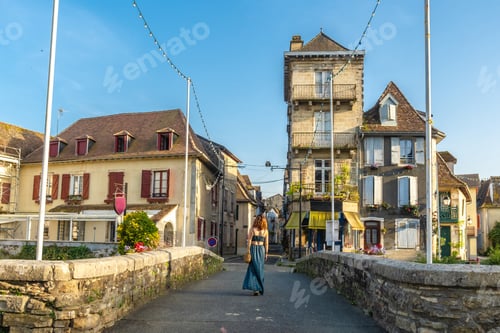 Preview: Tourist walking on a bridge in salies de bearn, france