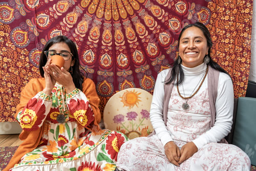 Preview: Women drinking organic cocoa during ceremony for alternative medicine and healthy living