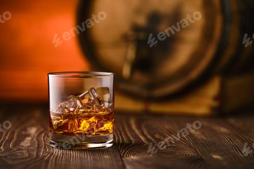 Preview: Glass of whiskey with ice with barrel on background