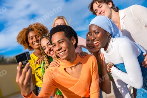 Preview: Trans person taking a selfie with friends