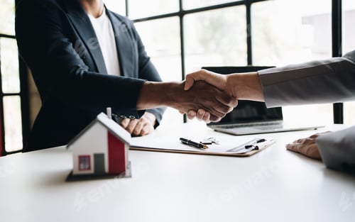 Preview: real estate broker manager hand shake to customer after signing contract for buying house.