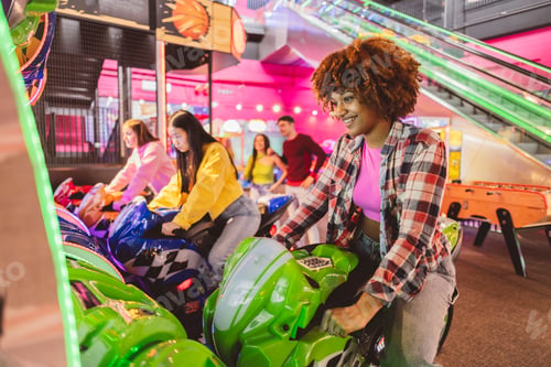 Preview: Young Woman on a Motorcycle Arcade Game at a Funfair
