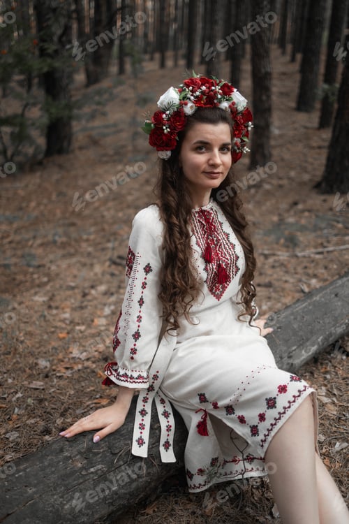 Preview: Authentic woman in traditional ukrainian costume in forest.