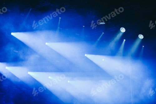 Preview: Blue stage lights at a rock concert
